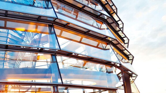 Exterior of a circular corporate building with glass windows