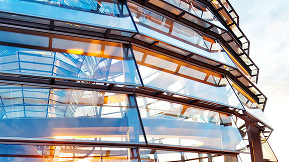 Exterior of a circular corporate building with glass windows