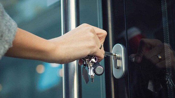 Close up of a person hand locking the door
