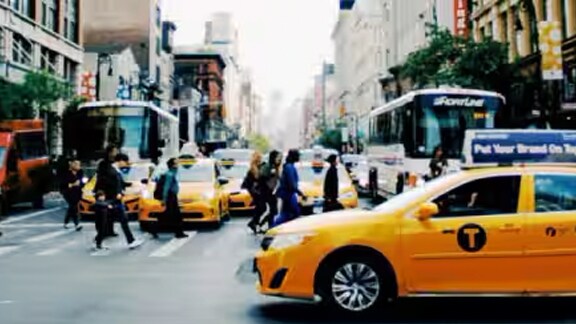 Yellow taxi and people walking on pedestrian